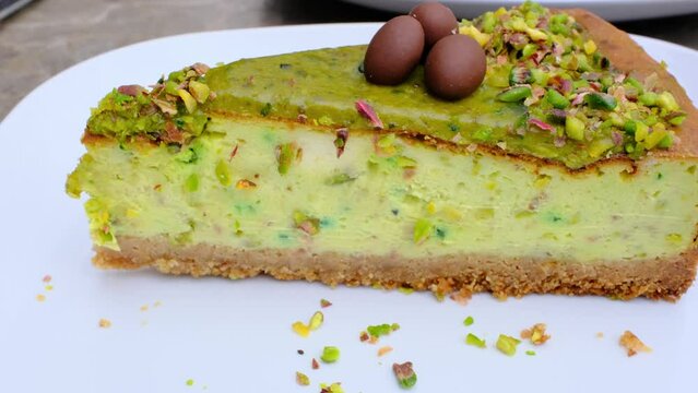 Pistachio and chocolate cheesecake with simple presentation