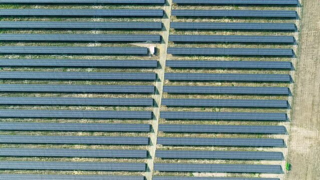Top down drone Shot of solar panels. Drone looks 90 degrees downwards