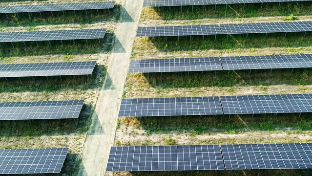 Top down drone Shot of solar panels. Drone looks 90 degrees downwards. Drone move up.