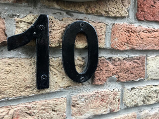 Close up of an house door number 10