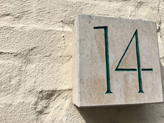Close up of an house door number 14