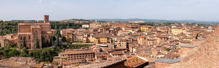 Fototapeta na wymiar Panorama of Siena with the basilica di San Domenico at the left