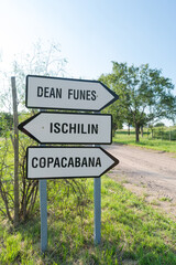 Road sign indicating directions to the towns of Dean Funes, Ischilin and Copacabana, this sign is located at the entrance to the small town of Ischilin, in the Province of Cordoba, Argentina.