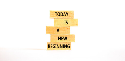 Today is a new beginning symbol. Concept words Today is a new beginning on wooden blocks. Beautiful...