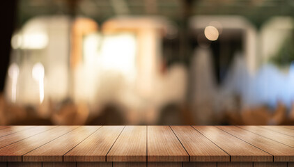 	
Empty wooden table top with lights bokeh on blur restaurant background.	
