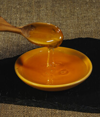 honey dripping from spoon