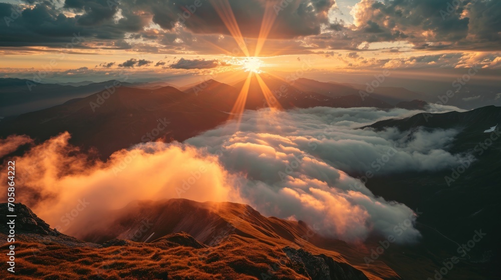 Poster the sun is setting over a mountain range with clouds in the foreground and a mountain range in the b