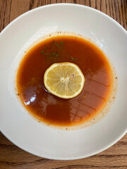 Sopa de Lima or lime soup is a traditional Mexican soup featuring a citrus-infused broth with shredded chicken, vegetables, and tortilla strips, topped with lime slices