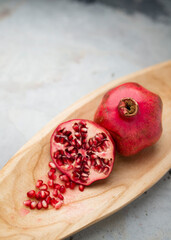Bright fresh pomegranate photographed in studio. 