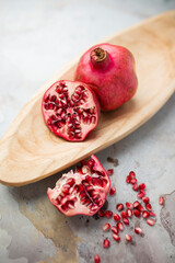 Bright fresh red pomegranates photographed in studio. 