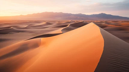Foto op Plexiglas Drone photograph of a vast desert landscape with rolling sand dunes at sunrise. © Hans