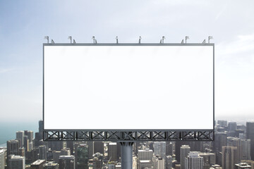 Blank white billboard on city buildings background at daytime, front view. Mockup, advertising...