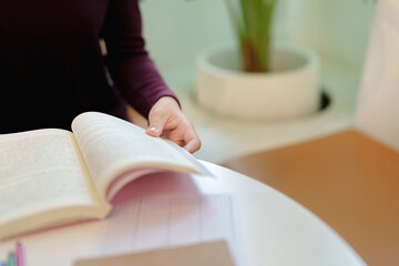 Self learning concept. Young woman student university Researching Book In Library. University Student 