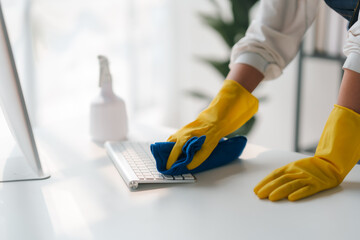 Housewife cleaning various equipment in the office.