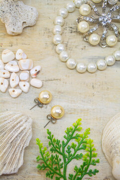 Pearl jewelry on a wooden background