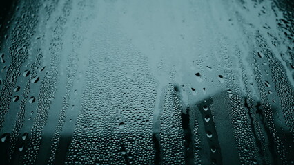 Moody day during cold winter season, droplets on glass window, condensation effect, depression...