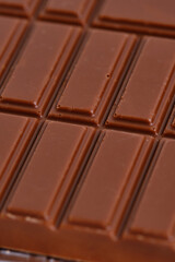 Bar of delicious milk chocolate closeup.