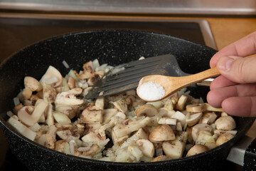 Cooking mushrooms with eggs and onions. Cooking at home. A series of photos.