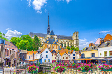 Amiens old town with multicolored houses and Amiens Cathedral Basilica of Our Lady Notre-Dame Roman Catholic church building, historical city centre, Picardy, Hauts-de-France Region, Northern France - obrazy, fototapety, plakaty