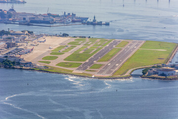 Rio de Janeiro, Brazil. Santos Dumont Airport. Airplane locking brakes with smoke on runway during...