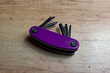 Multitool with Phillips screwdrivers and Allen keys, isolated with copyspace