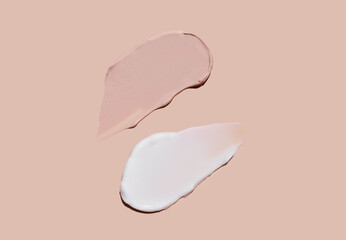 Cosmetic smear of cream texture on a beige background. Skin care. Tonal cream for the face.