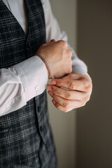 A close-up of a man and a woman holding hands. 5386