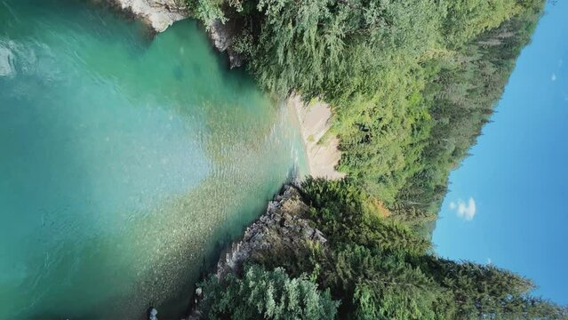 The Bolshaya Laba River. A mountain emerald river in a narrow, sunlit canyon. Bolshaya Laba River near the village of Psemen in Karachay-Cherkessia, Russia. Panoramic view. 4K