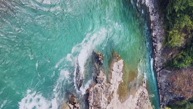 The Bolshaya Laba River. A mountain emerald river in a narrow, sunlit canyon. Bolshaya Laba River near the village of Psemen in Karachay-Cherkessia, Russia. Panoramic view. 4K