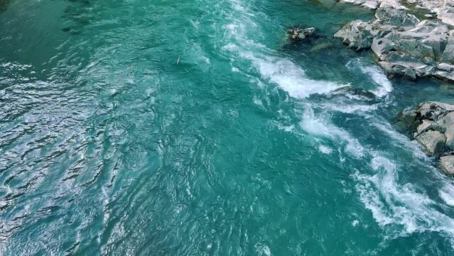 The Bolshaya Laba River. A mountain emerald river in a narrow, sunlit canyon. Bolshaya Laba River near the village of Psemen in Karachay-Cherkessia, Russia. Panoramic view. 4K