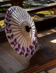 Japanese oil paper umbrella on a wooden terrace of traditional Japanese house