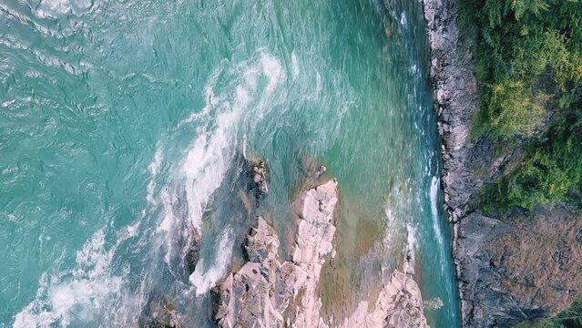 The Bolshaya Laba River. A mountain emerald river in a narrow, sunlit canyon. Bolshaya Laba River near the village of Psemen in Karachay-Cherkessia, Russia. Panoramic view. 4K