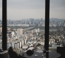 Fototapeta premium City skyline view of Seoul South Korea from window