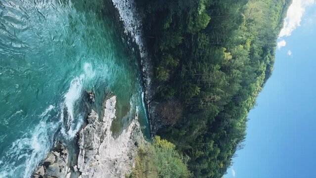 The Bolshaya Laba River. A mountain emerald river in a narrow, sunlit canyon. Bolshaya Laba River near the village of Psemen in Karachay-Cherkessia, Russia. Panoramic view. 4K