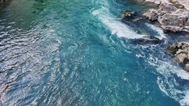 The Bolshaya Laba River. A mountain emerald river in a narrow, sunlit canyon. Bolshaya Laba River near the village of Psemen in Karachay-Cherkessia, Russia. Panoramic view. 4K