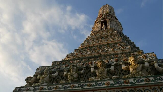 Time lapse of Prang (Khmer-Style Tower) at Temple of the Dawn (Wat Arun). Wat Arun is a most famous travel destinations in Bangkok and Thailand. It is located next to Chao Phraya River in Bangkok.  

