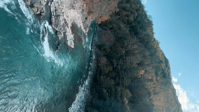 The Bolshaya Laba River. A mountain emerald river in a narrow, sunlit canyon. Bolshaya Laba River near the village of Psemen in Karachay-Cherkessia, Russia. Panoramic view. 4K
