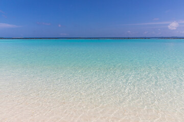Azure water in the lagoon of the tropical island in the Maldives