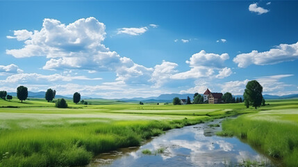 Spring landscape featuring green fields, a flowing river, fluffy clouds, distant mountains, and a solitary house.