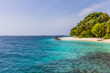 Fototapeta na wymiar Azure water in the lagoon of the tropical island in the Maldives