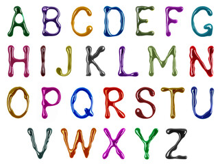 Colorful glossy large latin letters drawn with paint isolated on a white background