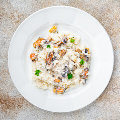 rice seafood risotto fresh eating cooking appetizer meal food snack on the table copy space food background rustic top view Pescetarian diet