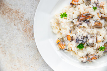 rice seafood risotto fresh eating cooking appetizer meal food snack on the table copy space food background rustic top view Pescetarian diet
