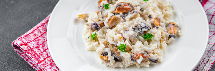 rice seafood risotto fresh eating cooking appetizer meal food snack on the table copy space food background rustic top view Pescetarian diet
