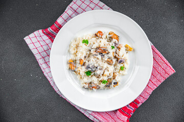 rice seafood risotto fresh eating cooking appetizer meal food snack on the table copy space food background rustic top view Pescetarian diet