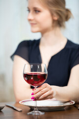 A ladies' night out with a glass of wine.