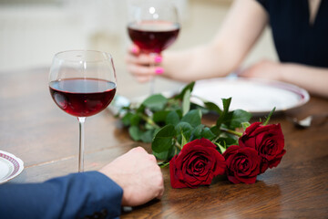 Romantic tableware on a wooden table, prepared for a date.
