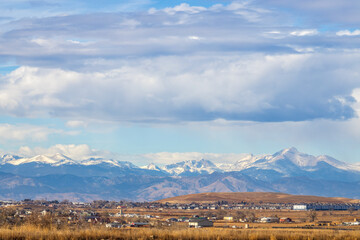 Colorado Living. Loveland, Colorado - Denver Metro Area Residential Winter Panorama with the view of Front Range mountains in the distance - obrazy, fototapety, plakaty