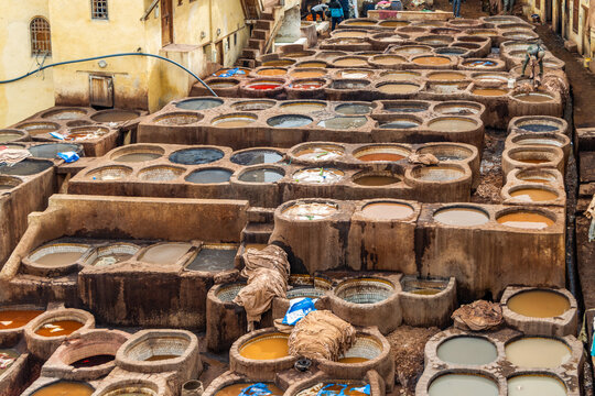 Old tanks of the Fez tanneries with color paint for leather, Morocco.