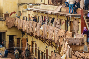Old tanks of the Fez tanneries with color paint for leather, Morocco.